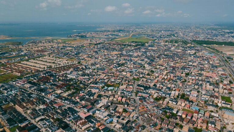 Mastering the Single Window: Why SEO-First Web Design Lagos is the Ultimate Key to 2026 NRS Digital Compliance 1 SEO-first web design Lagos: Stunning aerial view of Lagos, Nigeria showcasing urban landscape and coastline.